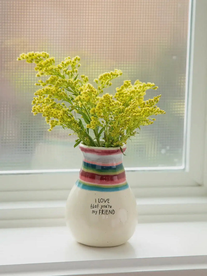 Striped vase with yellow flowers from FAVORITE BUD VASE - FRIEND, perfect for women’s boho chic clothing