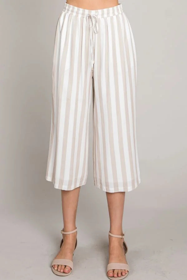 Woven flowy culottes in white and beige striped design, perfect for stylish summer wear