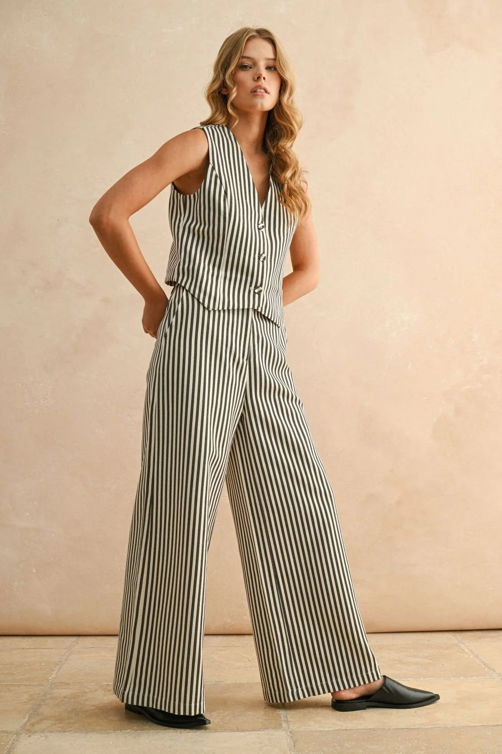 Stylish women’s boho chic clothing featuring striped button front vest and matching wide-leg pants at Shop Daisy