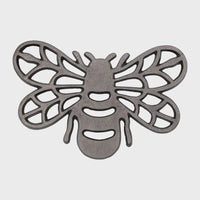 Stylized cast aluminum bee trivet with intricate wing patterns and detailed design