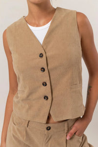 Tan corduroy vest with black buttons and pocket from Shop Daisy, ideal for women’s boho chic clothing