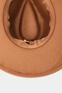 Tan felt cowboy hat with pinched crown and curved brim featuring concho shell band