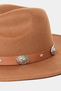 Tan felt fedora hat featuring a concho shell band with silver concho decorations