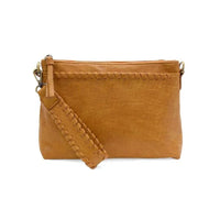 Tan vegan leather clutch with woven wristlet strap and removable shoulder strap