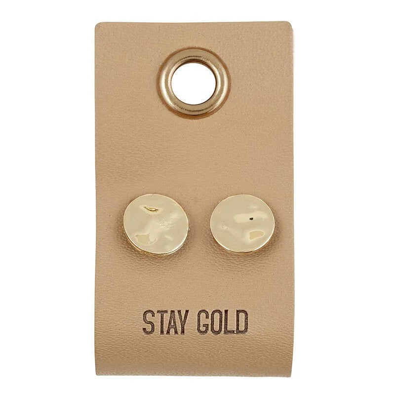 Tan leather tag earrings with grommet and gold studs featuring STAY GOLD text