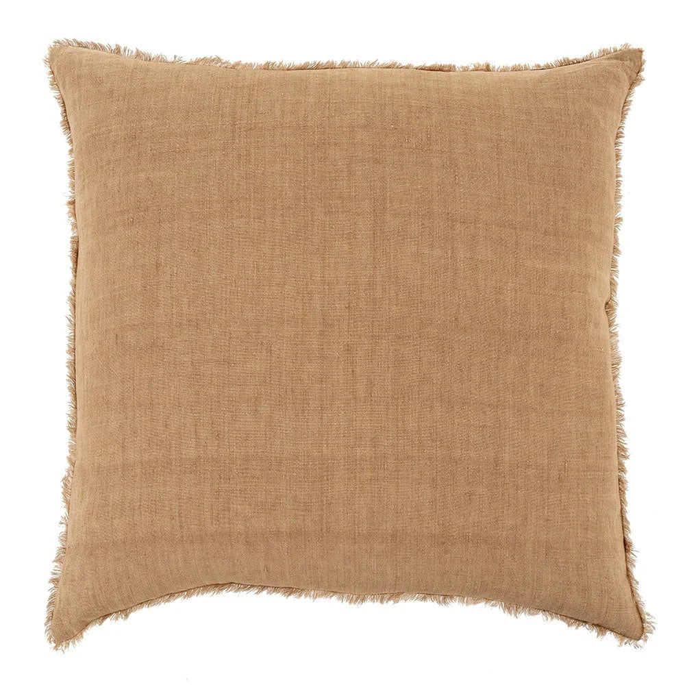 Tan linen throw pillow with frayed edges for a boho, free spirit decor vibe