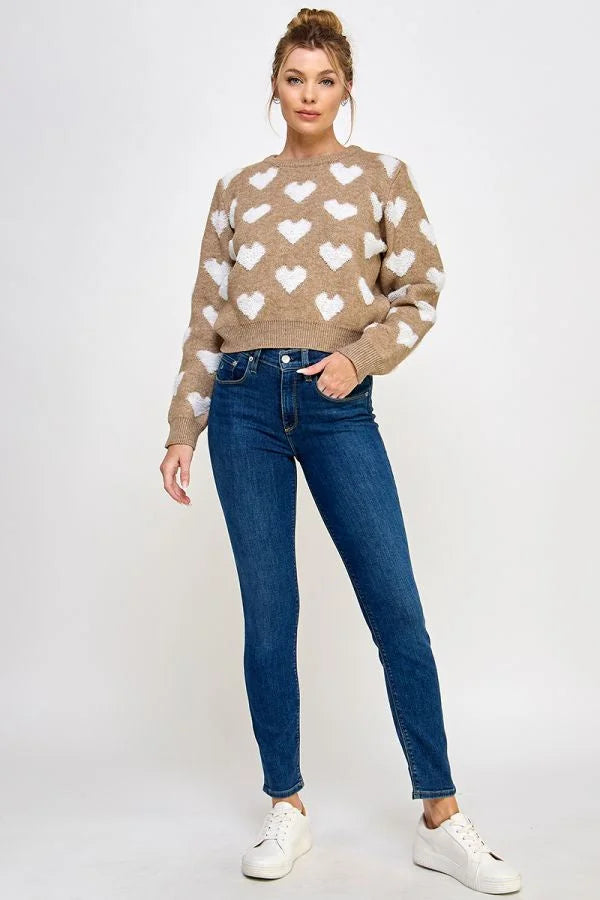 Tan Raised Heart Long Sleeve Pullover Sweater styled with blue jeans and white sneakers