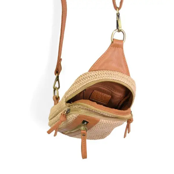 Tan woven sling bag displayed in the STRAW SKYLER SLING BAG product image for crossbody style