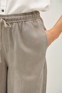 Taupe drawstring pants with pockets ideal for women’s boho chic clothing from Shop Daisy