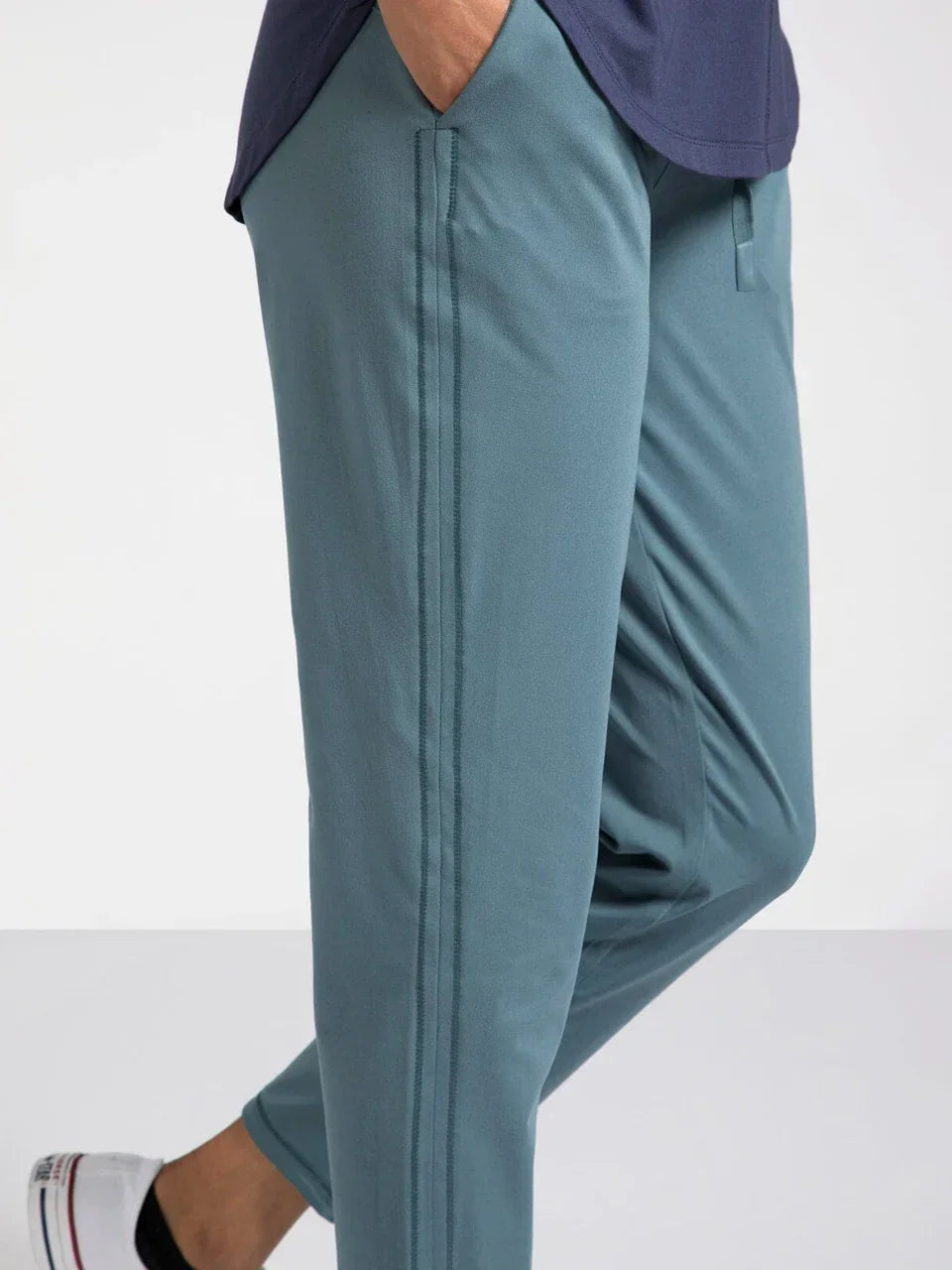 Teal Harla pants from Thread and Supply with white sneakers and navy top