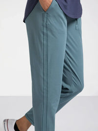 Teal Harla pants from Thread and Supply with white sneakers and navy top