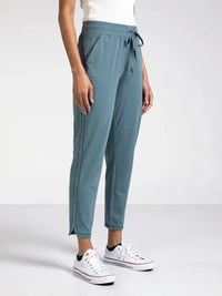 Teal Thread and Supply Harla Pants with white Converse sneakers