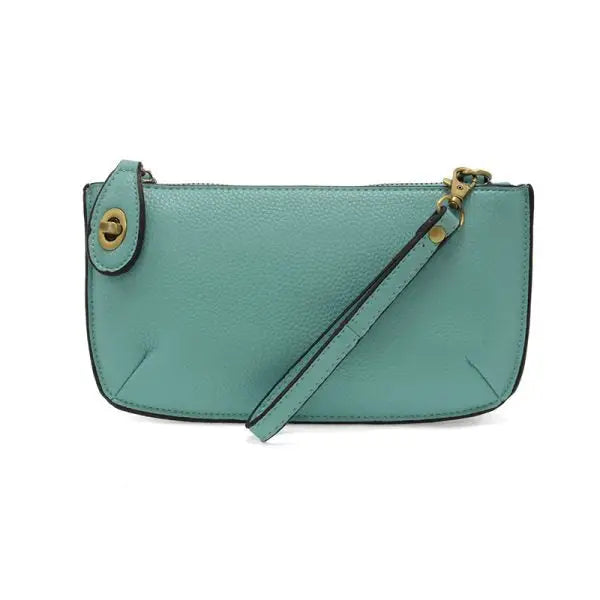 Teal leather wristlet clutch featuring card slots from Shop Daisy’s women’s boho chic collection