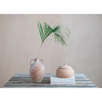 Terracotta urn with two handles in natural color, perfect for decorative use