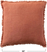 Terracotta stonewashed linen throw pillow with frayed edges, ideal for stylish decor