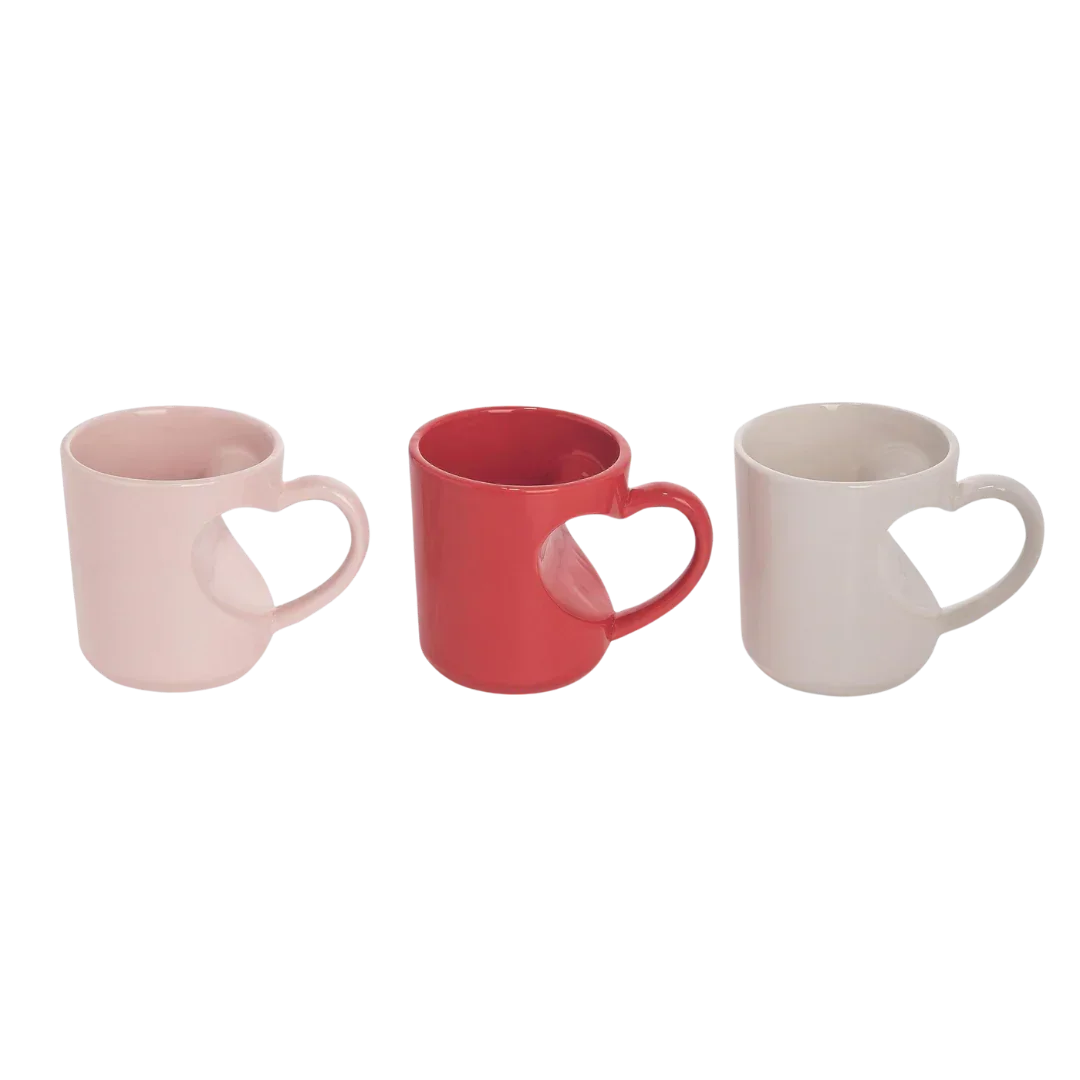 Three heart shaped mugs in pink, red, and white perfect for Valentine’s Day gifts