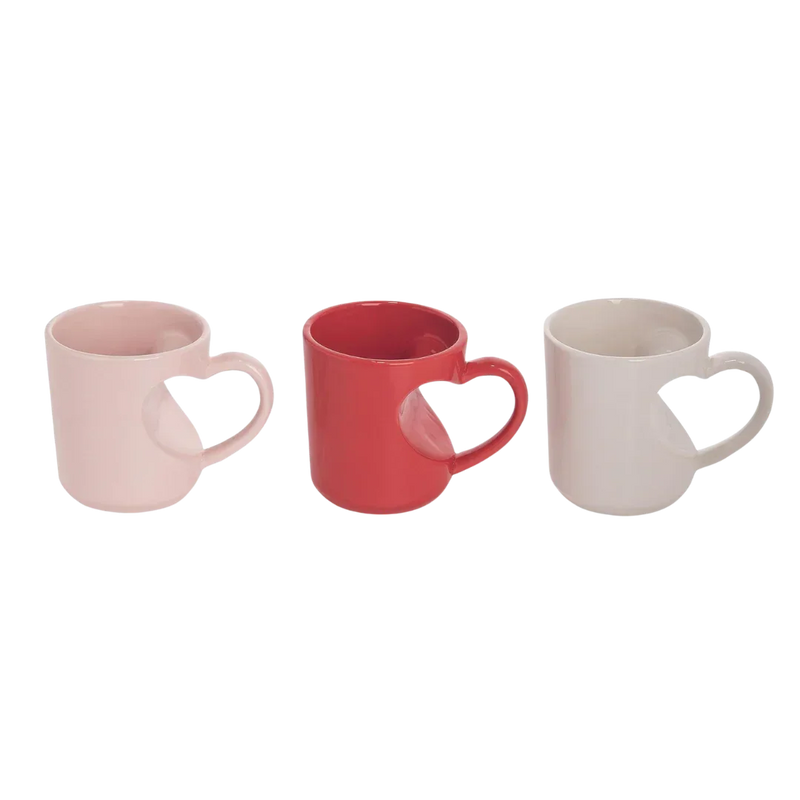 Three heart shaped mugs in pink, red, and white perfect for Valentine’s Day gifts