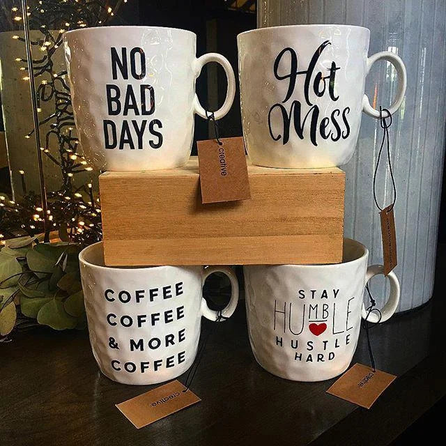 Three Hot Mess Mugs featuring the phrases no bad days and stay here for a cheerful vibe