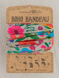 Three colorful elastic hair ties featured with the LIGHT TAUPE FOLK FLOWER HEADBAND