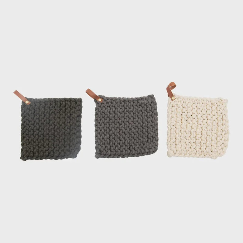 Crocheted pot holders in gray and cream with leather loop for stylish kitchen decor