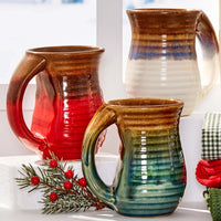 Three Blue Cozy Ceramic Mugs displayed elegantly on a window sill