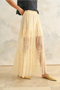 Tiered cream maxi skirt showcasing women’s boho chic clothing from Shop Daisy