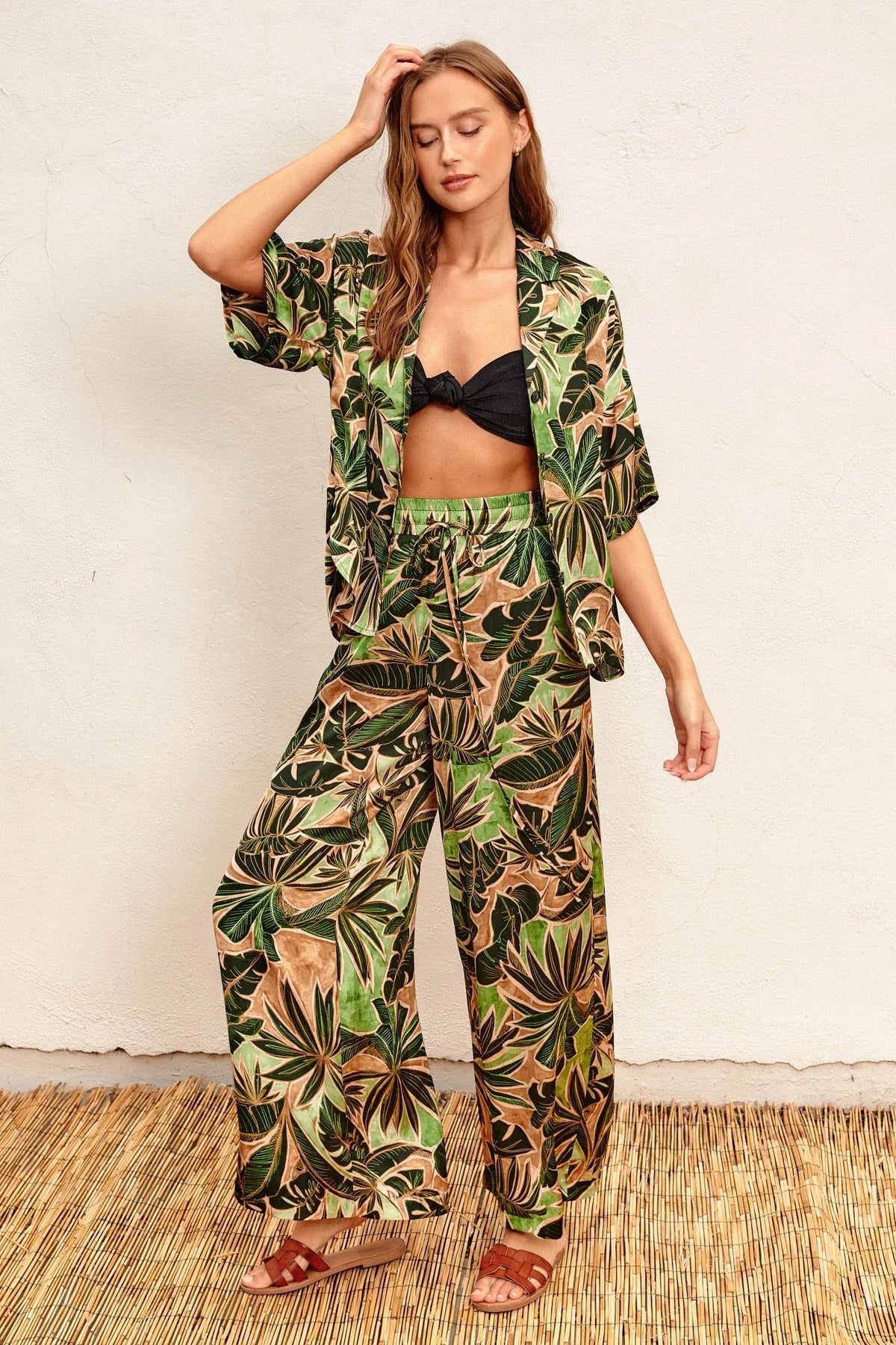 Tropical print kimono top and wide leg pull-on pants set over a black bikini top