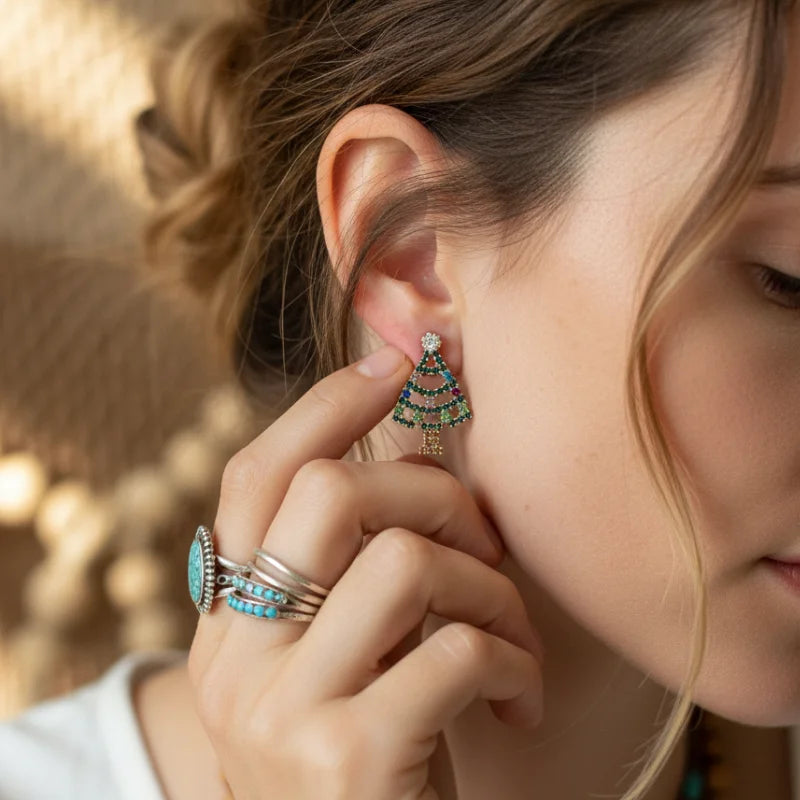 Vibrant turquoise and silver Christmas tree earrings with geometric bohemian triangles