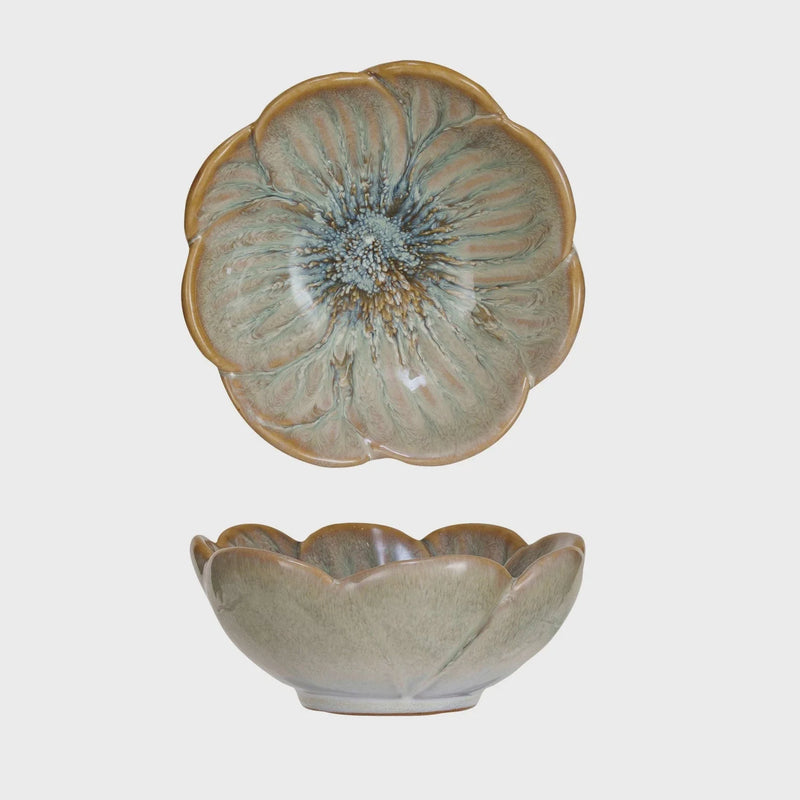 Two stoneware flower shaped bowls with a decorative flower design on top