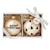 Two elegant glass Christmas ornaments in a gift box with decorative ribbon