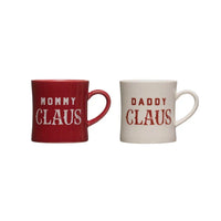 Two red and white Mommy Daddy Claus stoneware mugs for festive holiday enjoyment