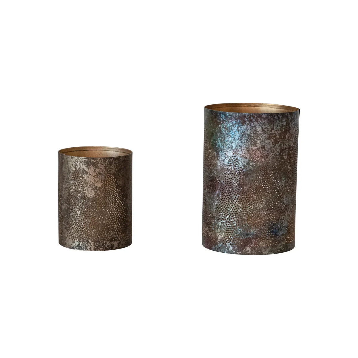 Two metal votive holders with oxidized gold patina and tree cut-outs for rustic decor