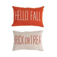 Decorative throw pillows with autumn text, ideal for fall trick decor from Shop Daisy