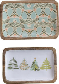 Two decorative serving trays with winter-themed tree and botanical patterns in elegant design