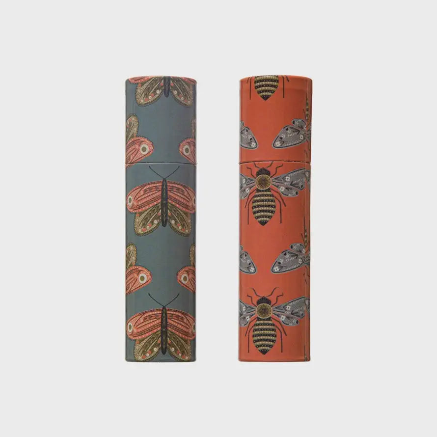 Two decorative wallpaper rolls with butterfly and bee patterns in orange and blue-gray