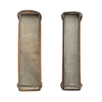 Two rustic metal trays with curved edges featured in a Bohemian wood and metal tray