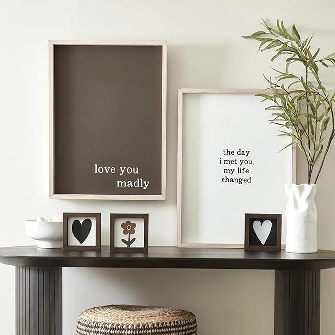 Two framed romantic quotes on a shelf with a plant, ideal for a Valentine’s Day gift for her