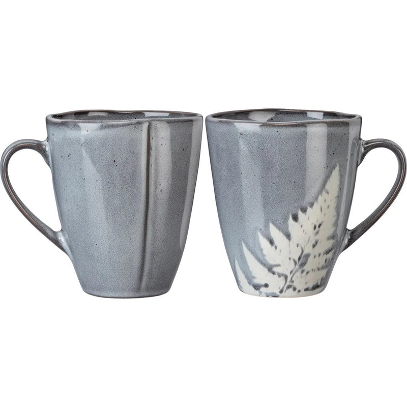 Two grey Botanical Fern Mugs adorned with delicate white flowers on display