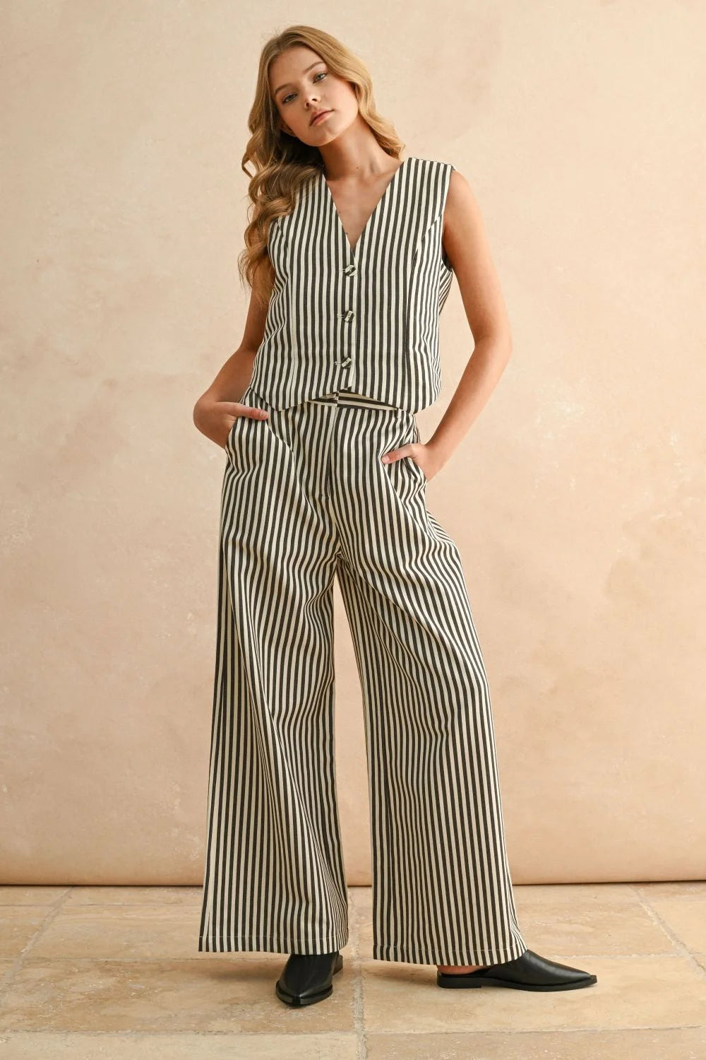 Striped pattern wide leg pants set featuring a two-piece striped vest and trousers