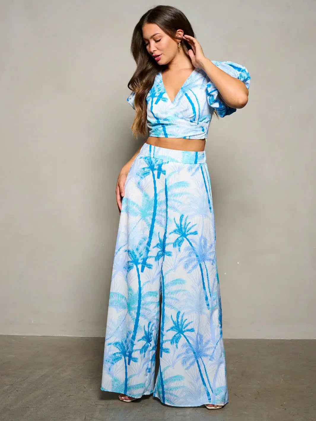 Two-piece tropical print outfit showcasing women’s boho chic clothing with crop top and palazzo pants