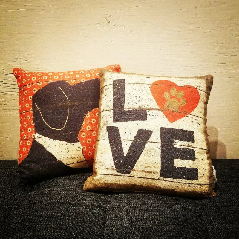 Two decorative Dog Love Pillows featuring heartfelt designs for dog lovers