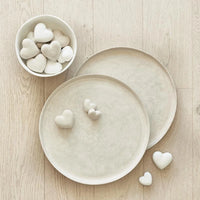 Two round ceramic plates with heart designs for PAPER MACHE HEART WHITE at Shop Daisy