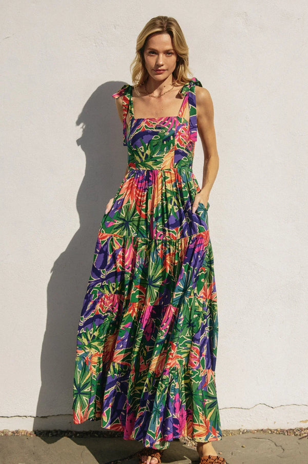 Vibrant tropical smocked tie shoulder maxi dress with floral tiers and shoulder ties