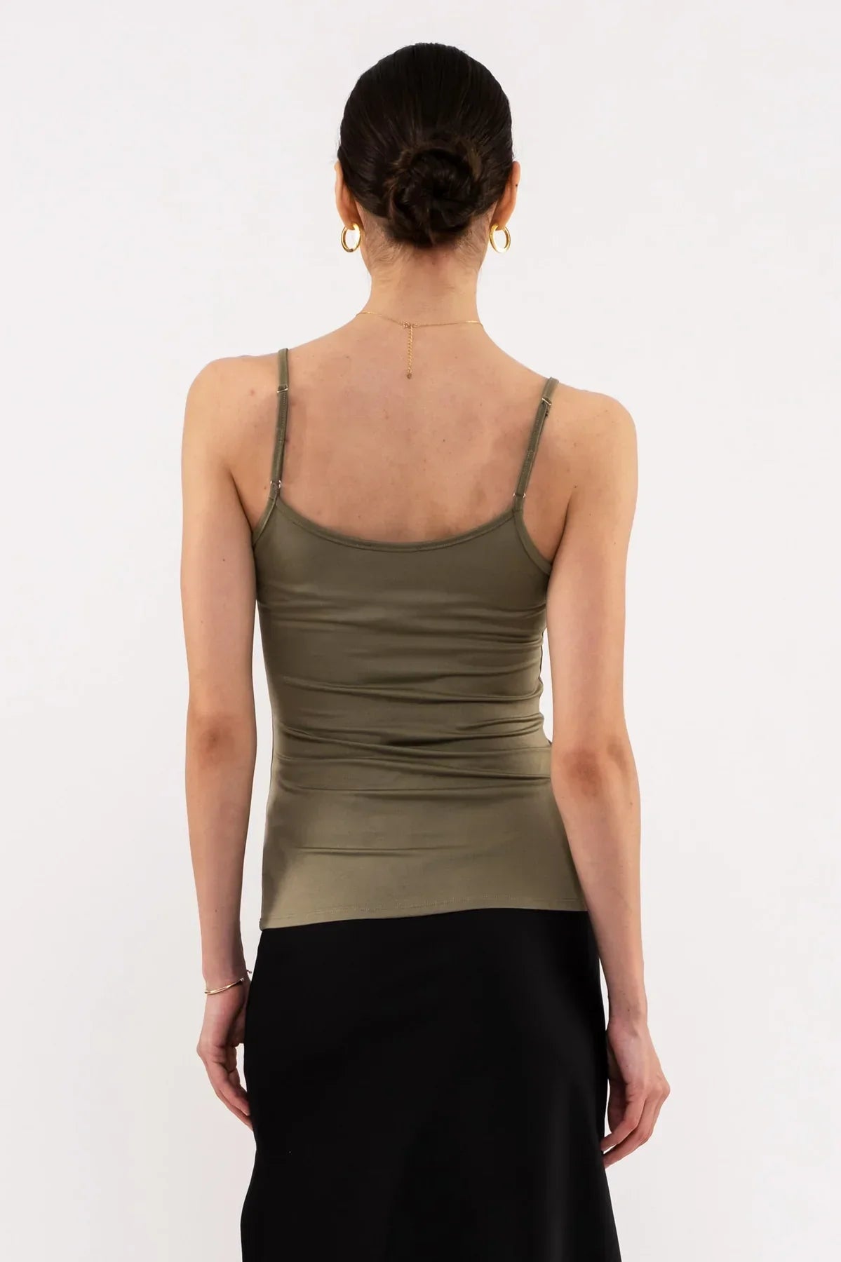 Back view of SOLID SPAGHETTI STRAP TANK TOP in olive green, perfect for women’s boho chic clothing