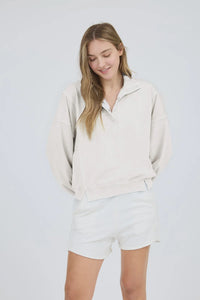 Light-colored washed half snap long sleeve knit top with matching shorts for casual style