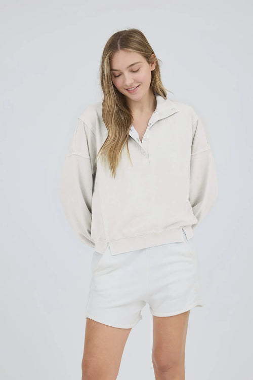 Light-colored washed half snap long sleeve knit top with matching shorts for casual style