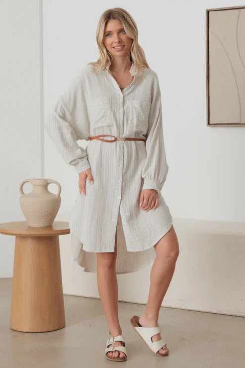 White belted shirt dress with long sleeves, a high-low hem, perfect for women’s boho chic clothing