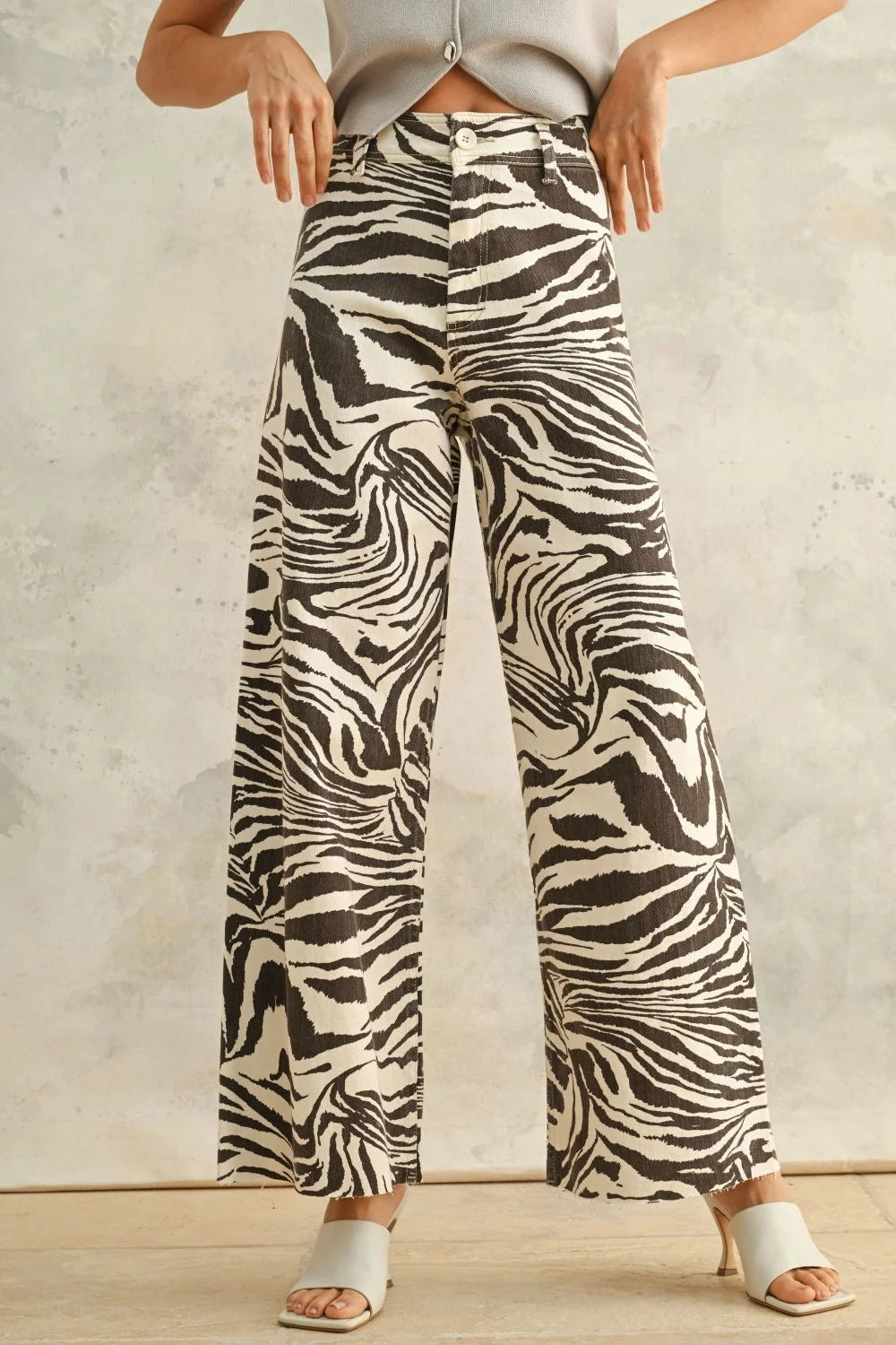 White and black zebra print stretch pants with wide-leg design for stylish comfort