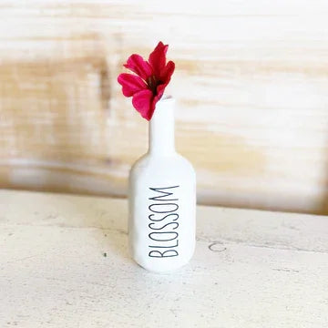 White ceramic bud vase with BLOSSOM text and red flower, ideal for women’s boho chic clothing