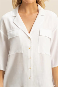 White linen button-down shirt with pockets from LINEN BLENDED OVERSIZED SHORT SLEEVE TOP, perfect for women’s boho chic clothing at Shop Daisy